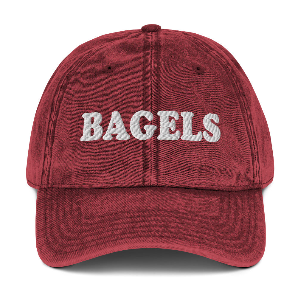 Maroon Bagels Hat - Our vintage style Bagels Hat is comfortable, adjustable and made just for you. It comes in a variety of colors with a Bagels, expertly embroidered on the front. The perfect hat for bagel enthusiasts and everyday foodies of all kinds.