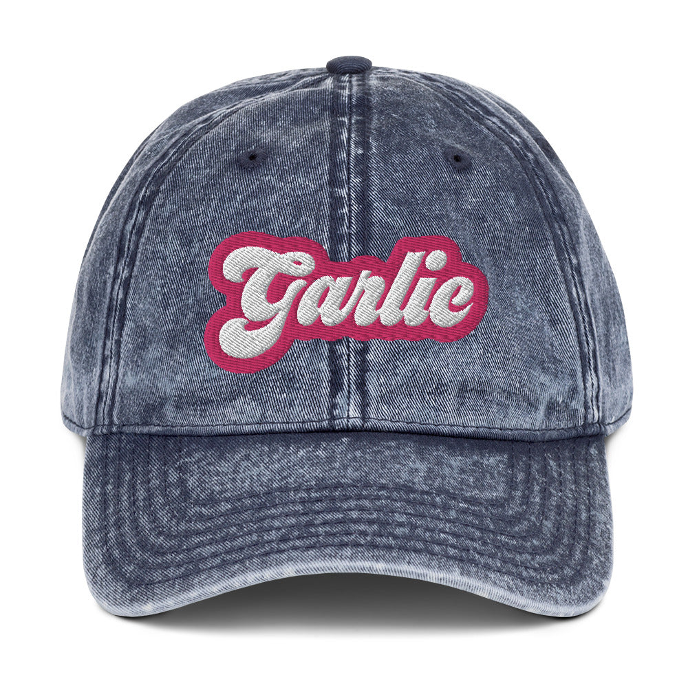 Blue garlic dad hat - A colorful dad hat for garlic enthusiasts and foodies of all kinds. It's a vintage style dad hat with the word "garlic" embroidered in pink and white. A funny statement hat for garlic lovers to stand out and show off or a unique gift for your favorite garlic addict. This quirky dad hat is adjustable, weird and made just for you.