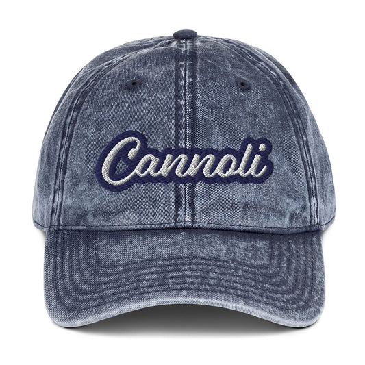 Blue cannoli dad hat - A unique dad can designed for cannoli lovers and foodies. Eat your favorite cannoli in style and show off your love for this classic Italian dessert in our unique foodie dad hat. This cannoli hat is has a washed out vintage style and a white and blue embroidery. Perfect for cannoli lovers and foodies of all kinds. 