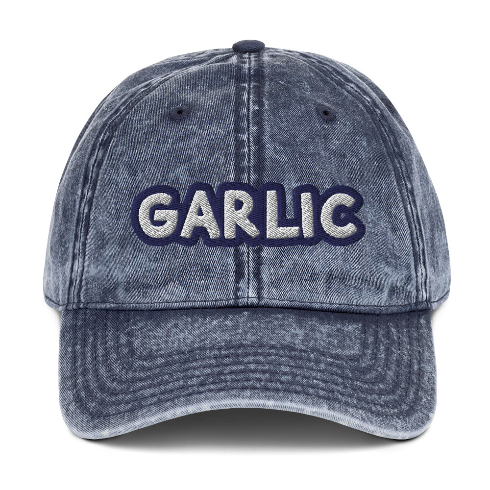 Blue garlic dad hat from Nina's Funky Shop by ninanush - If you're a garlic lover, this funny food hat was designed just for you. Eat garlic in style and make a statement in this stand out foodie dad hat. It's a garlic lover hat that's made of cotton, with a washed out vintage style and an eye-catching blue and white embroidery. Perfect for garlic enthusiasts and foodies of all kinds.