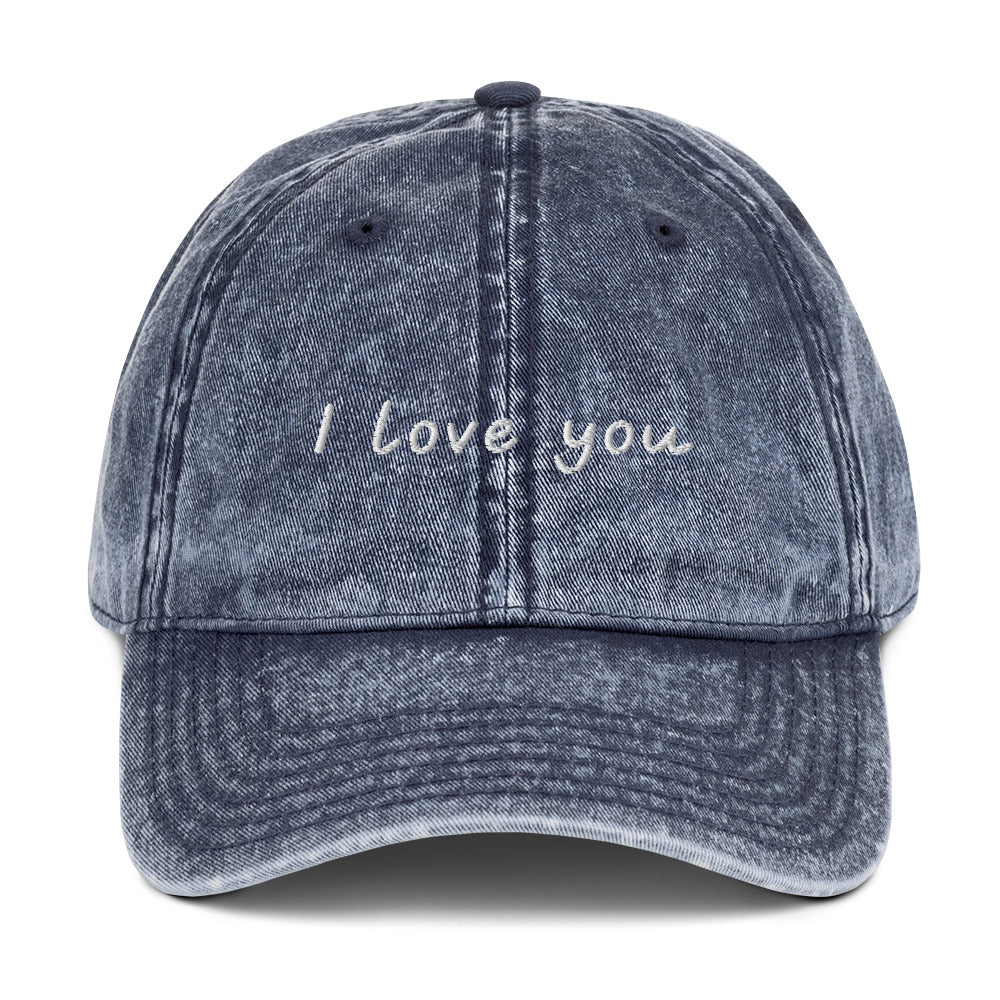 Blue I Love You Hat - Let your hat do the talking and spread the love in our "I Love You Dad Hat." It's a classic cotton dad hat with a positive design, expertly embroidered on the front. Looking for something personalized? Shoot us an email!