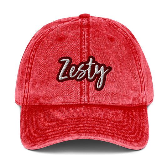 Red zesty dad hat - The Zesty Dad Hat, a perfect accessory to add a touch of personality to your outfit. With a vintage-style faded look, a red and white unique embroidery, and an adjustable strap, this quirky dad hat was made just for you. Wear this colorful dad hat as everyday wear or give this hat as a funny gift to a zesty friend.