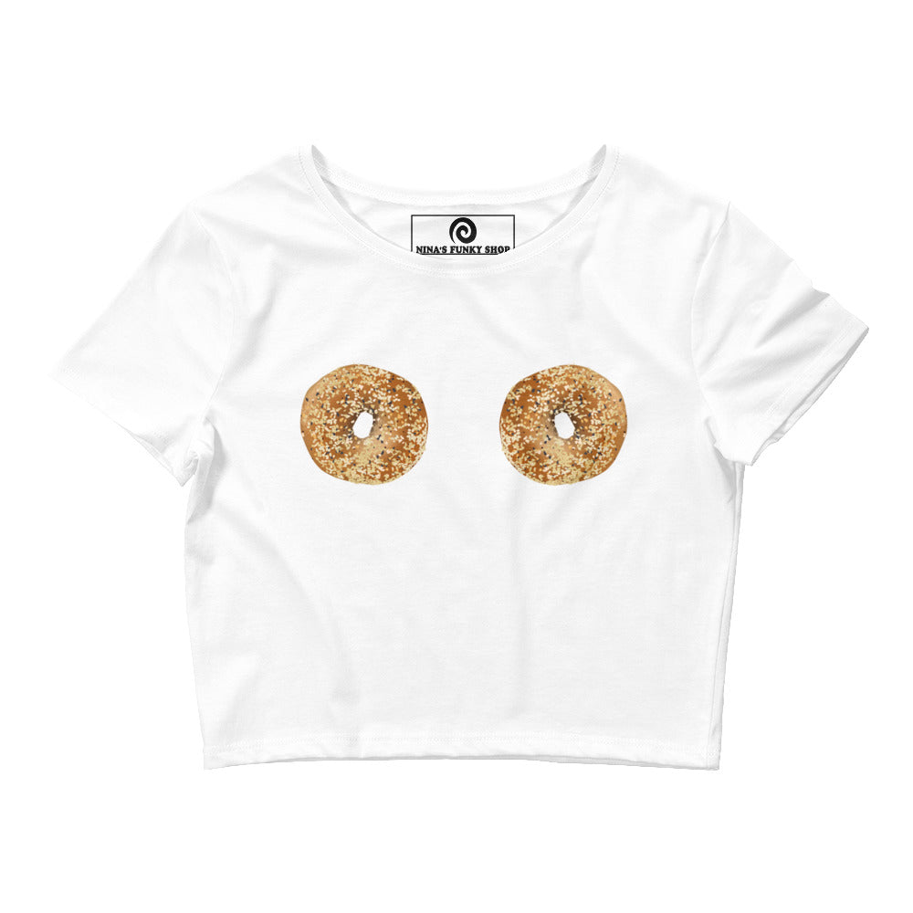 White Bagel Boobs T-Shirt - Our Bagel Boobs Crop Tee is comfortable and perfect for everyday streetwear. It's a tight-fitting crop top with everything bagels, expertly printed on the front. Make a statement and eat your favorite bagels in this funny food t-shirt for bagel enthusiasts and foodies of all kinds.