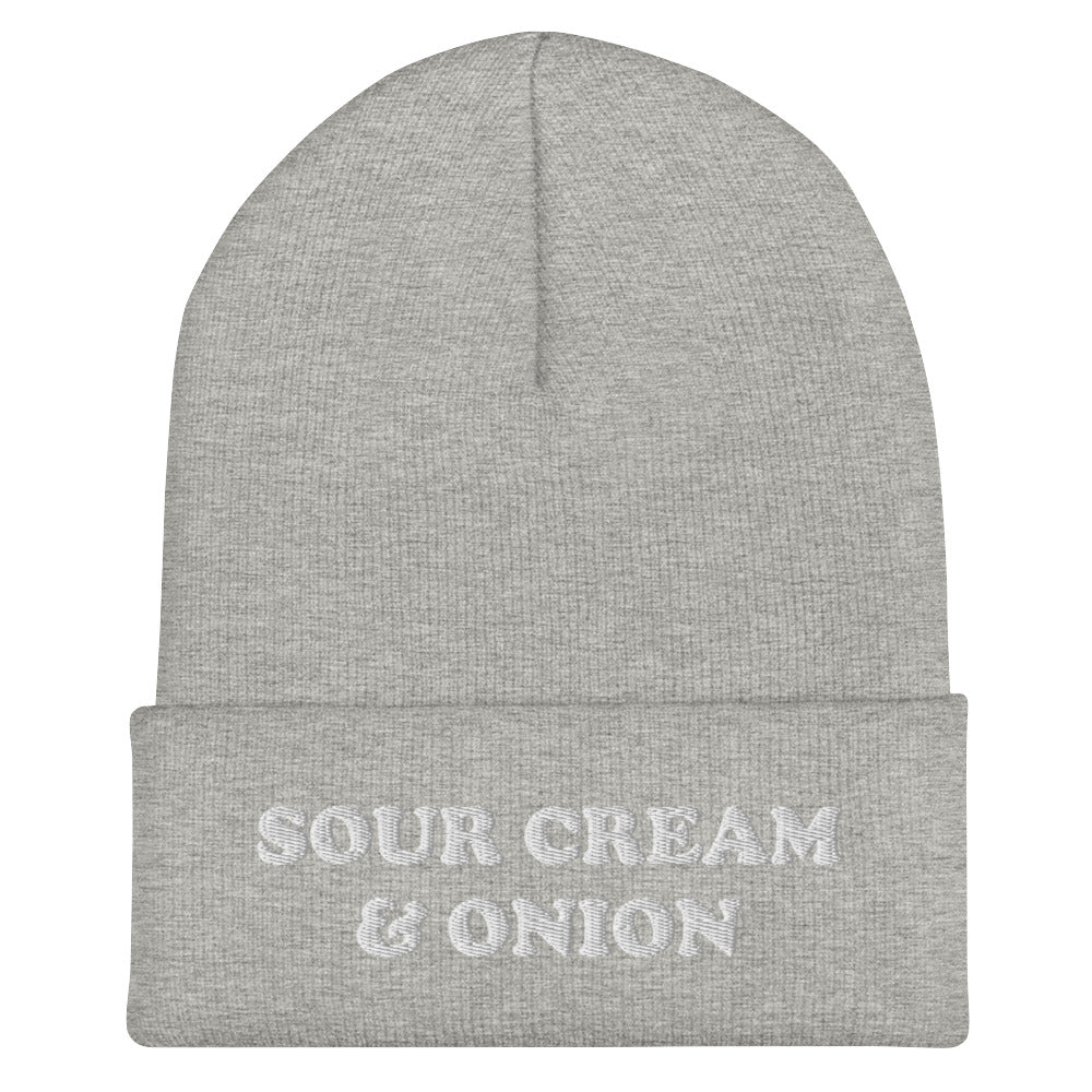 Light gray with white embroidery sour cream and onion beanie hat for cold weather. This sour cream and onion beanie hat is exactly what every chip lover needs. Eat your favorite chips in this funny food beanie. It's a unique beanie for foodies and a weird gift and for chip lovers and sour cream & onion enthusiasts. Celebrate your favorite chips in our sour cream and onion hat, and foodie clothing.