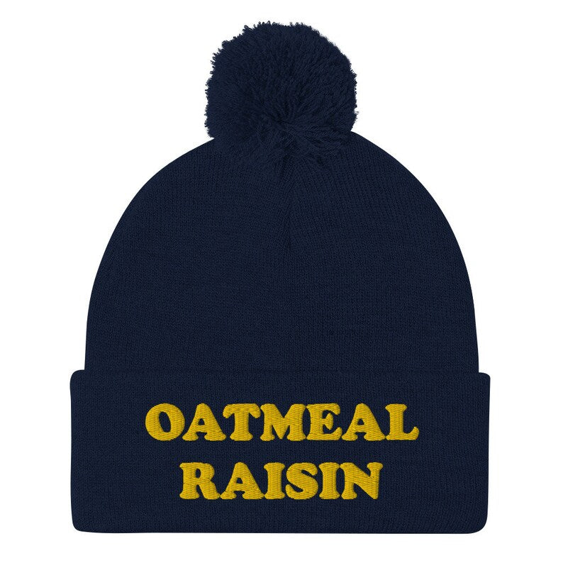 Navy oatmeal raisin beanie - Eat oatmeal raisin cookies in style with this funny foodie beanie. It's a unisex embroidered beanie that's perfect for cookie enthusiasts of all kinds. If you love oatmeal raisin, this weird foodie hat is a must have. Wear this warm and cozy hat it or give it as a funny gift for foodies and oatmeal raisin enthusiasts.