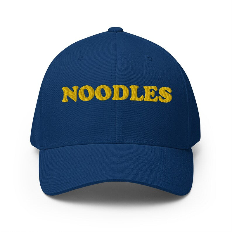 Funny royal blue noodle hat - A funny statement hat for foodies and noodle lovers. It's a classic embroidered hat with the word noodles. This funny foodie hat is comfortable, unique and a perfect hat for noodle enthusiasts! Stay weird and eat noodles in this weird and unusual hat. It's a hat that's sure to get attention and maybe even noodles.