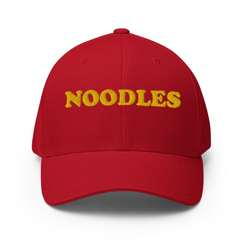 Red funny noodle hat - A funny statement hat for foodies and noodle lovers. It's a classic embroidered hat with the word noodles. This funny foodie hat is comfortable, unique and a perfect hat for noodle enthusiasts! Stay weird and eat noodles in this weird and unusual hat. It's a hat that's sure to get attention and maybe even noodles.