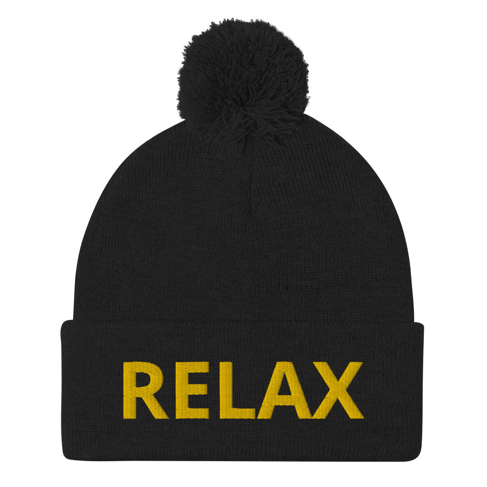 Black Relax beanie hat from Nina's Funky Shop - Relax in this statement beanie. It's a warm and cozy beanie with "relax", expertly embroidered on the front. A funny hat with a classic pom pom on top and a yellow design. Designed by Nina and made just for you.