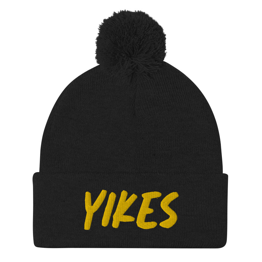 This funky yikes beanie is a unique and quirky winter hat. The yikes beanie is warm and cozy with a classic pom pom on top and a yellow "YIKES" embroidery. This funny beanie is a perfect weird gift that's unique and original. Shop funny foodie beanies, weird hats, funky vegan t-shirts, unique eco friendly hats and more. 