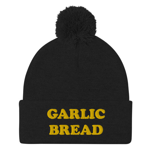 Black garlic bread beanie with pompom - This garlic bread beanie is a perfect warm and cozy hat for cold weather. Everyone loves garlic bread and now you can eat it in a classic beanie with a pom pom on top. Stay funky in this weird hat for foodies and garlic bread enthusiasts. It's funny, unusual and sure to get attention from your garlic loving friends.