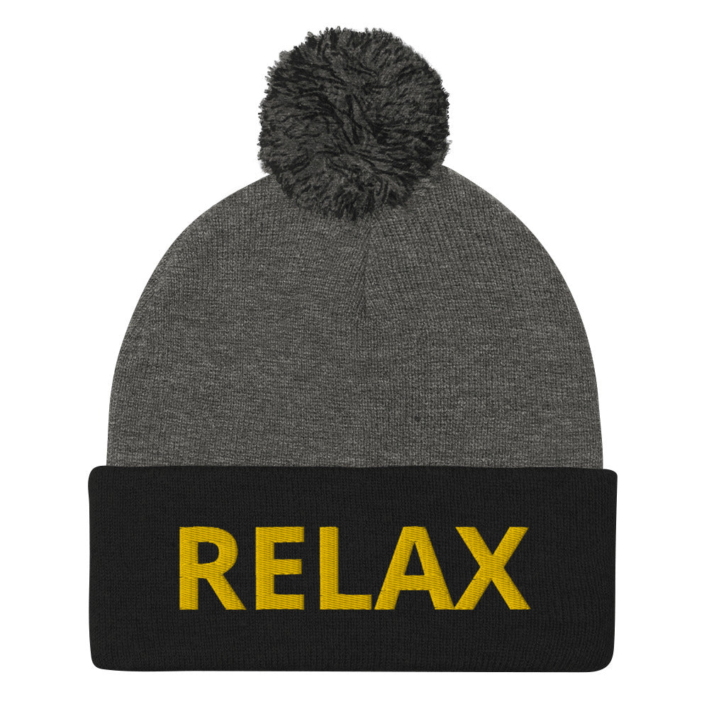 Black and gray Relax beanie hat from Nina's Funky Shop - Relax in this statement beanie. It's a warm and cozy beanie with "relax", expertly embroidered on the front. A funny hat with a classic pom pom on top and a yellow design. Designed by Nina and made just for you.