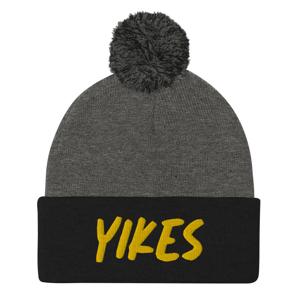 This funky yikes beanie is a unique and quirky winter hat. The yikes beanie is warm and cozy with a classic pom pom on top and a yellow "YIKES" embroidery. This funny beanie is a perfect weird gift that's unique and original. Shop funny foodie beanies, weird hats, funky vegan t-shirts, unique eco friendly hats and more. 