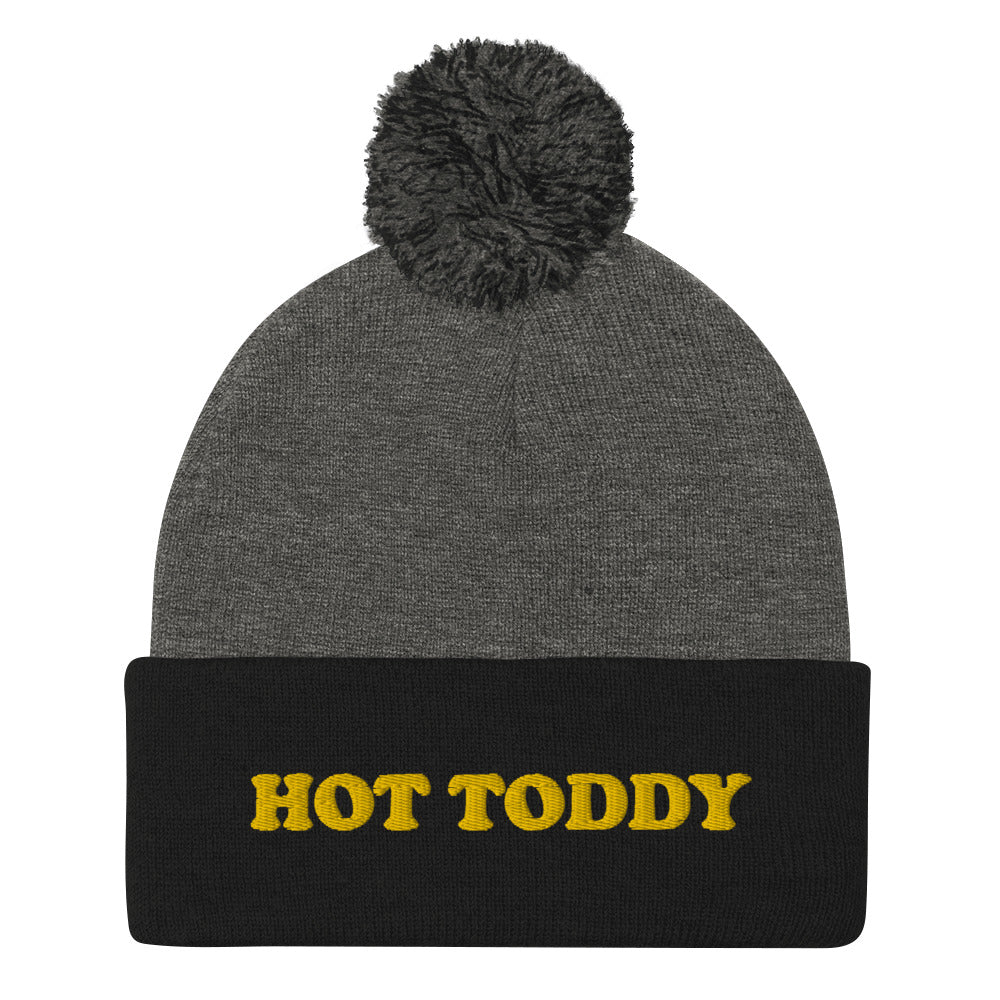 Black and gray hot toddy beanie with yellow embroidery - This Hot Toddy Beanie is a perfect everyday accessory for hot toddy lovers. It's a cozy and warm hat with a pom pom on top and a unique embroidery of your favorite drink. Stay warm in style in this unisex hot toddy beanie, made just for you. Or give it as a cute gift for your favorite hot toddy enthusiast.