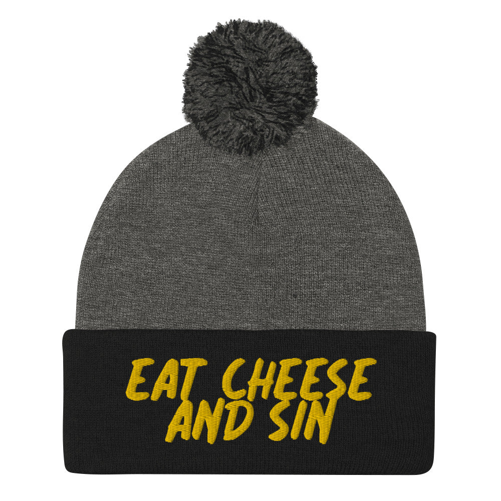 Gray and black eat cheese and sun beanie hat for foodies - Eat cheese and sin beanie. It's a cozy beanie with yellow embroidery and a classic pom pom on top. This unique cheese lover beanie is a funny gift for foodies and a weird hat for everyday naughty cheese enthusiasts. Stay weird and celebrate your favorite foods and drinks in our funny foodie clothing and accessories.