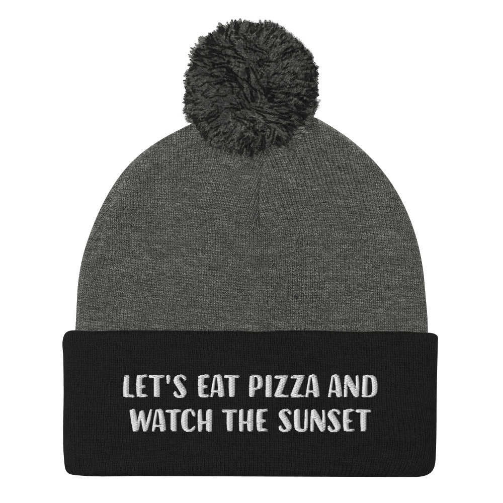 Black and gray pizza and sunset beanie for foodies - Let's eat pizza and watch the sunset in a unique beanie with a funny message. This cute beanie is a warm hat for cozy nights in and outdoor adventures. It's a classic unisex embroidered beanie with a pom pom on top. Love sunsets and pizza? Wear this funny foodie beanie or give it as a unique gift for pizza lovers.  