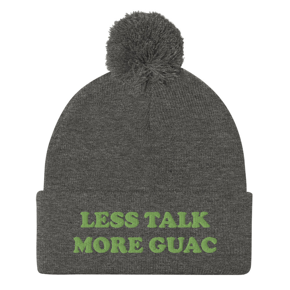 Gray guacamole beanie with green embroidery. Less talk more guac! Make your priorities clear in this unique guacamole beanie hat. It's a classic pom pom beanie with a funky foodie yellow embroidery. This funny food quote hat is a perfect foodie beanie or unique gift for guacamole lovers. Now you can wear a funky guacamole quote hat and eat guacamole in style. 