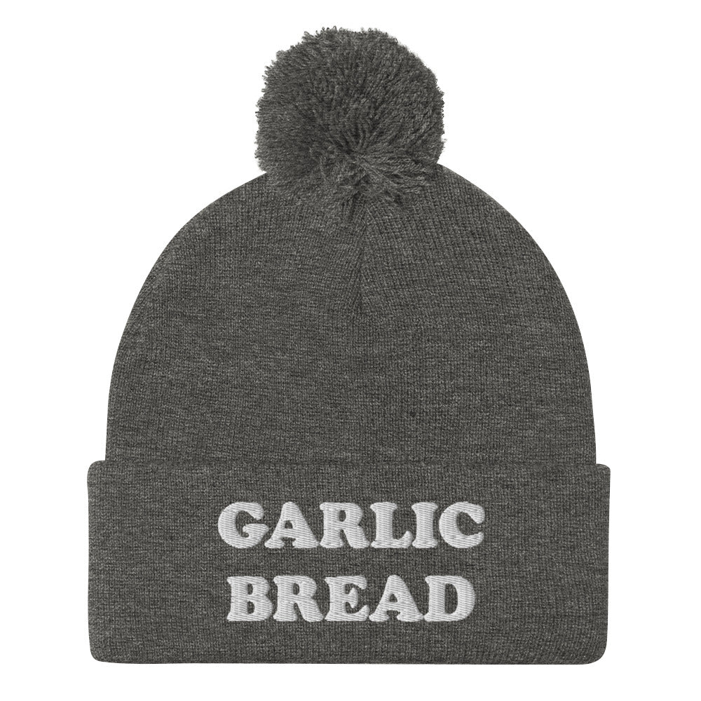 Gray and white garlic bread beanie hat - This garlic bread beanie is a perfect warm and cozy hat for cold weather. Everyone loves garlic bread and now you can eat it in a classic beanie with a pom pom on top. Stay funky in this weird hat for foodies and garlic bread enthusiasts. It's funny, unusual and sure to get attention from your garlic loving friends.