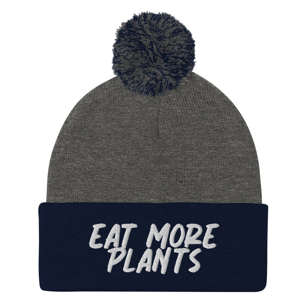 Eat more plants beanie! For the animals, for the planet, and for your health. This warm and meaningful hat has "eat more plants" embroidered in white and a pom pom on top. A unique gift for vegans and activists. Shop garlic hats, vegan friendly graphic tees, eco friendly hoodies and more. All unique and original designs. 