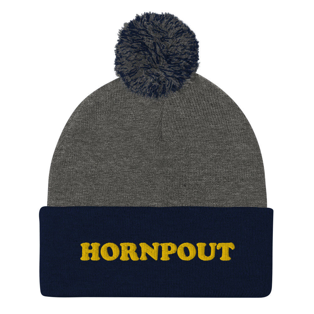 An embroidered "HORNPOUT" beanie with a pom-pom on top. This funky weird beanie is warm and cozy. It's a weird winter fishing hat that's unique & original. The hornpout hat is a weird beanie for fishing and a quirky street wear hat, too. Shop weird hats, funny beanies for foodies, and weird gifts for animal lovers. 