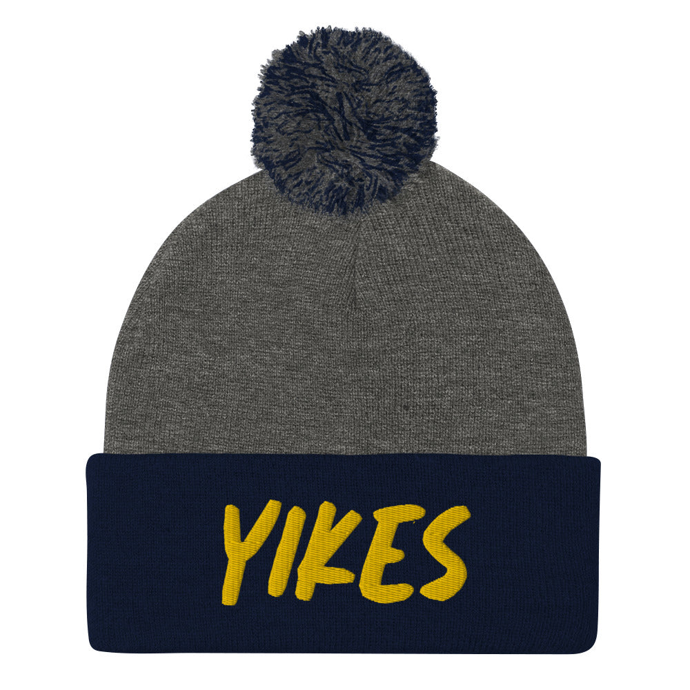 This funky yikes beanie is a unique and quirky winter hat. The yikes beanie is warm and cozy with a classic pom pom on top and a yellow "YIKES" embroidery. This funny beanie is a perfect weird gift that's unique and original. Shop funny foodie beanies, weird hats, funky vegan t-shirts, unique eco friendly hats and more. 