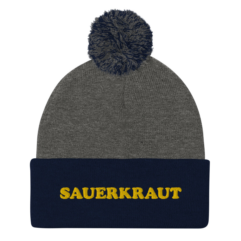 Navy blue and gray sauerkraut hat. This sauerkraut beanie is a comfortable and funny hat for foodies. If you like weird beanies or you love sauerkraut, this funky food hat is just for you. Give it as a weird gift for foodies or sauerkraut enthusiasts. Stay funky in this classic funny food beanie with a pom pom on top a unique and funky yellow embroidery. 