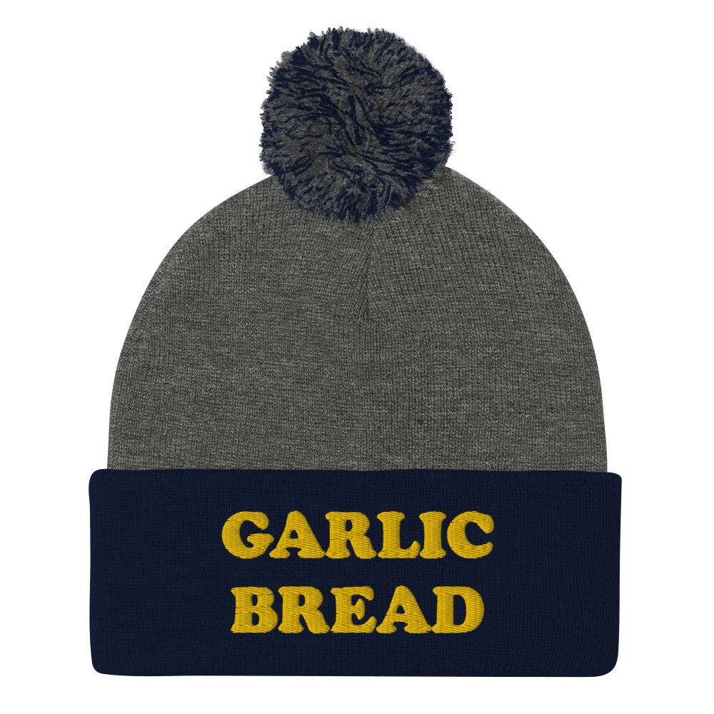 Navy and gray garlic bread beanie with pompom- This garlic bread beanie is a perfect warm and cozy hat for cold weather. Everyone loves garlic bread and now you can eat it in a classic beanie with a pom pom on top. Stay funky in this weird hat for foodies and garlic bread enthusiasts. It's funny, unusual and sure to get attention from your garlic loving friends.