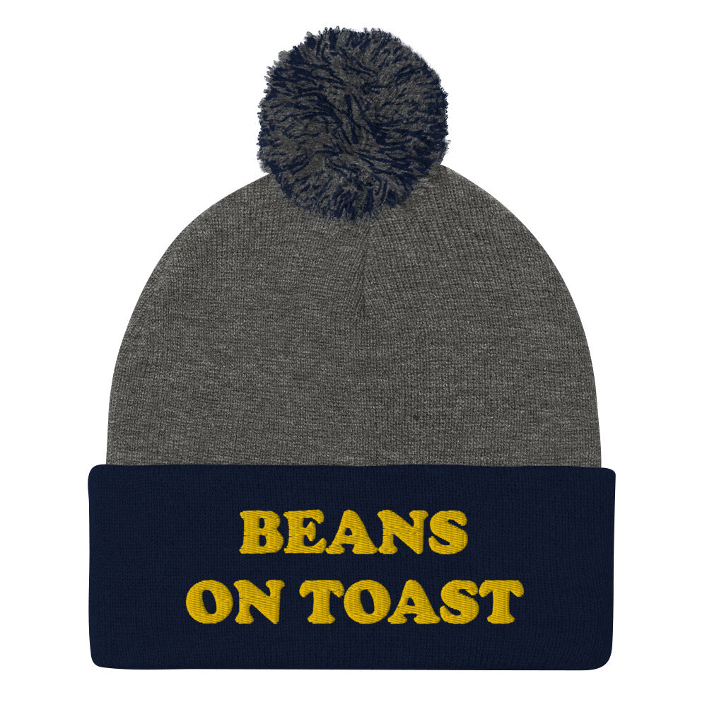 Navy blue and gray beans on toast beanie with pompom - British food beanie - This beans on toast beanie is a unique, warm & cozy hat. It's a classic beanie with a pompom and a funny food embroidery. Celebrate your favorite British foods in our funny food hats and weird food clothing. This beans on toast, British food beanie can be a funny gift for foodies or a weird hat for everyday streetwear.