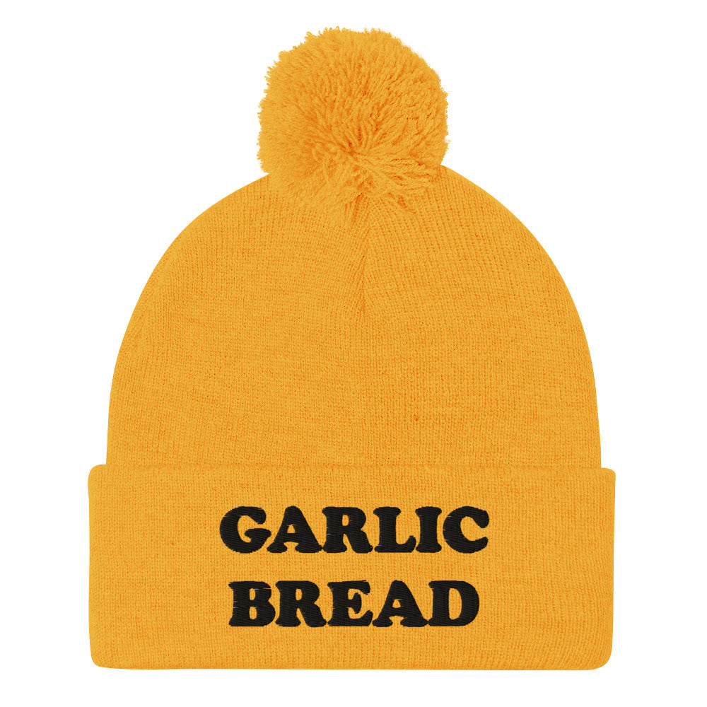 Yellow and black garlic bread beanie hat - This garlic bread beanie is a perfect warm and cozy hat for cold weather. Everyone loves garlic bread and now you can eat it in a classic beanie with a pom pom on top. Stay funky in this weird hat for foodies and garlic bread enthusiasts. It's funny, unusual and sure to get attention from your garlic loving friends.