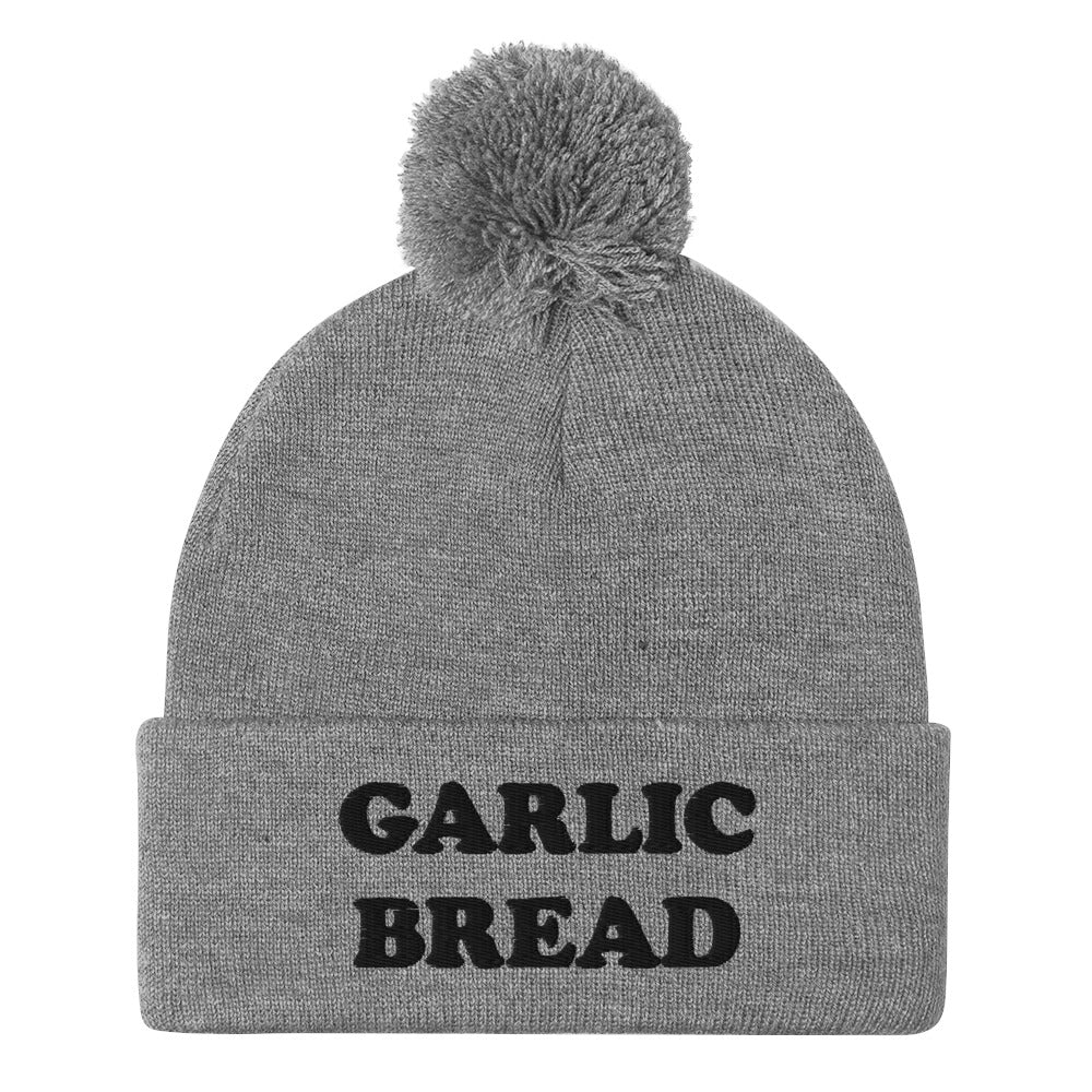 Gray and black garlic bread beanie hat - This garlic bread beanie is a perfect warm and cozy hat for cold weather. Everyone loves garlic bread and now you can eat it in a classic beanie with a pom pom on top. Stay funky in this weird hat for foodies and garlic bread enthusiasts. It's funny, unusual and sure to get attention from your garlic loving friends.