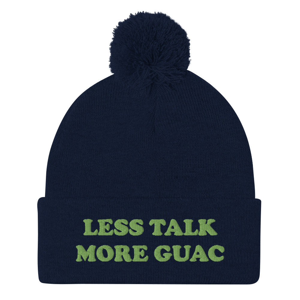 Navy blue guacamole hat with green embroidery. Less talk more guac! Make your priorities clear in this unique guacamole beanie hat. It's a classic pom pom beanie with a funky foodie yellow embroidery. This funny food quote hat is a perfect foodie beanie or unique gift for guacamole lovers. Now you can wear a funky guacamole quote hat and eat guacamole in style. 