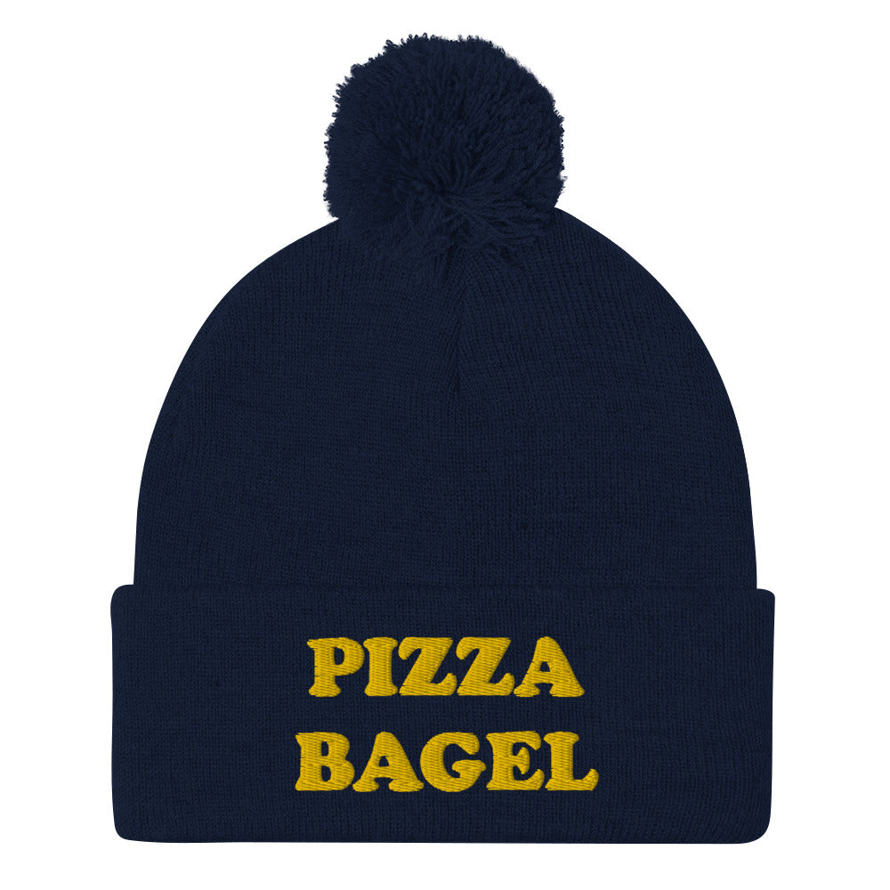 Navy blue pizza bagel beanie hat - This pizza bagel beanie is funny, unique and just what every pizza bagel lover needs. It's a cozy beanie with a pom pom on top and a pizza bagel foodie embroidery. Our funky foodie clothing and accessories celebrate your favorite foods and things that bring you joy. Stay weird and wear what makes you smile.