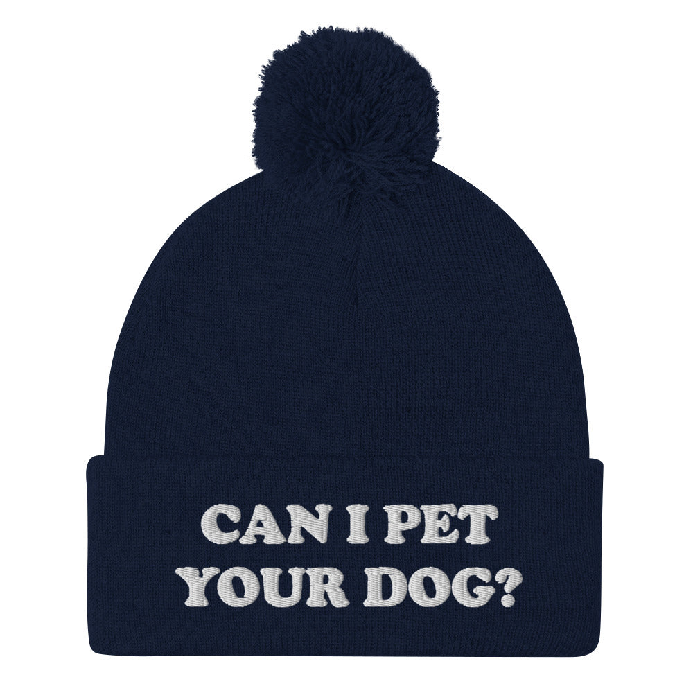 Can I pet your dog? Beanie hat in navy blue with white embroidery - Love petting dogs? Let your hat do the talking. This 'Can I pet your dog?' beanie is what every dog lover needs. It's a funny beanie with a unique embroidery to help you pet more dogs. This cozy pompom beanie is perfect for looking good and petting dogs. Stay weird in our funky animal lover clothing and accessories.