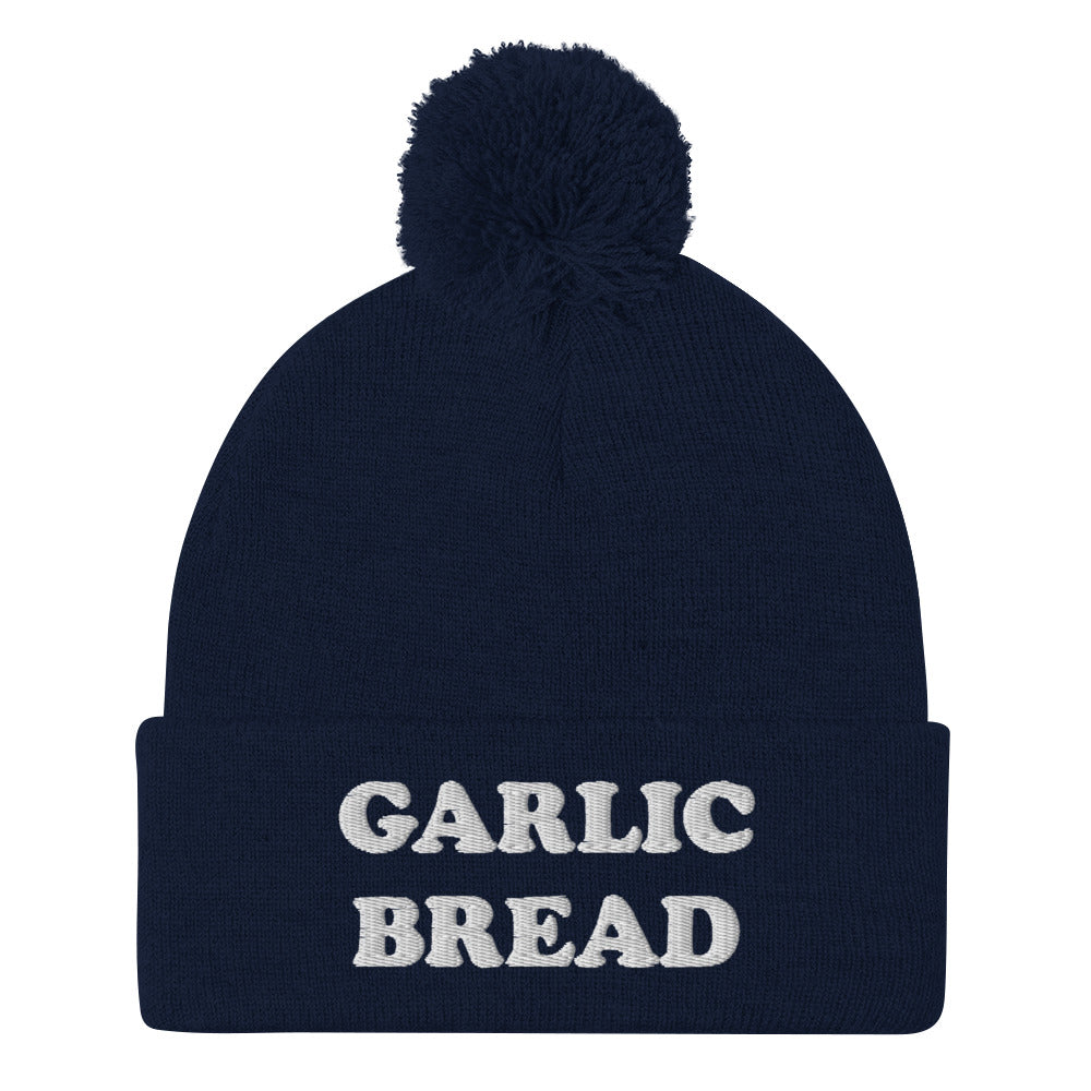 Navy blue and white garlic bread beanie hat - This garlic bread beanie is a perfect warm and cozy hat for cold weather. Everyone loves garlic bread and now you can eat it in a classic beanie with a pom pom on top. Stay funky in this weird hat for foodies and garlic bread enthusiasts. It's funny, unusual and sure to get attention from your garlic loving friends.