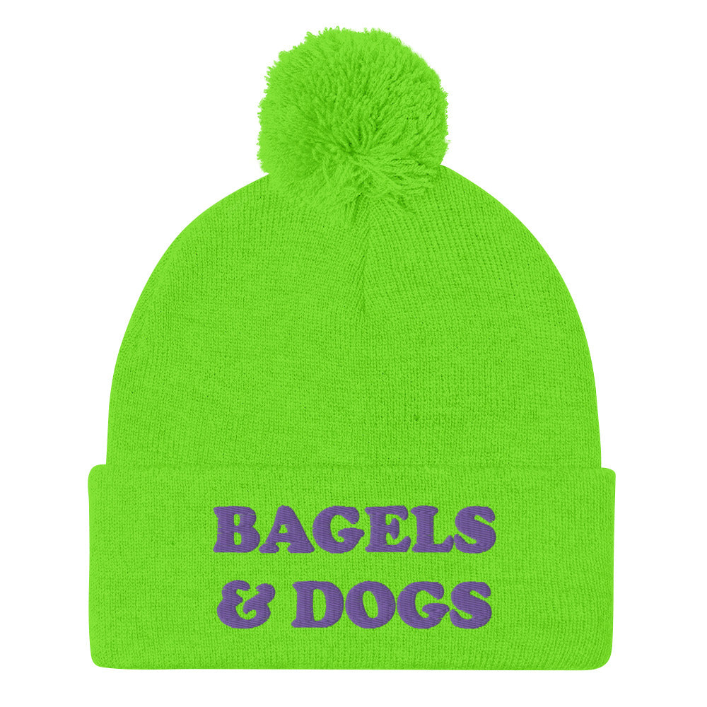 Bagels and dogs bright green beanie with purple embroidery - Keep your priorities in check with this bagels and dogs beanie with a pom pom on top. It's a unique and funny beanie for foodies and animal lover. Now you can eat bagels and pet dogs in a cozy hat that makes people smile. Stay weird and celebrate your favorite foods and animals in our funky clothing and accessories.