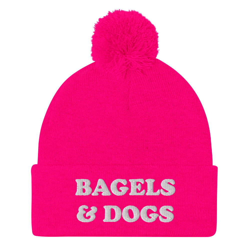 Hot pink bagels and dogs beanie with white embroidery - Keep your priorities in check with this bagels and dogs beanie with a pom pom on top. It's a unique and funny beanie for foodies and animal lover. Now you can eat bagels and pet dogs in a cozy hat that makes people smile. Stay weird and celebrate your favorite foods and animals in our funky clothing and accessories.