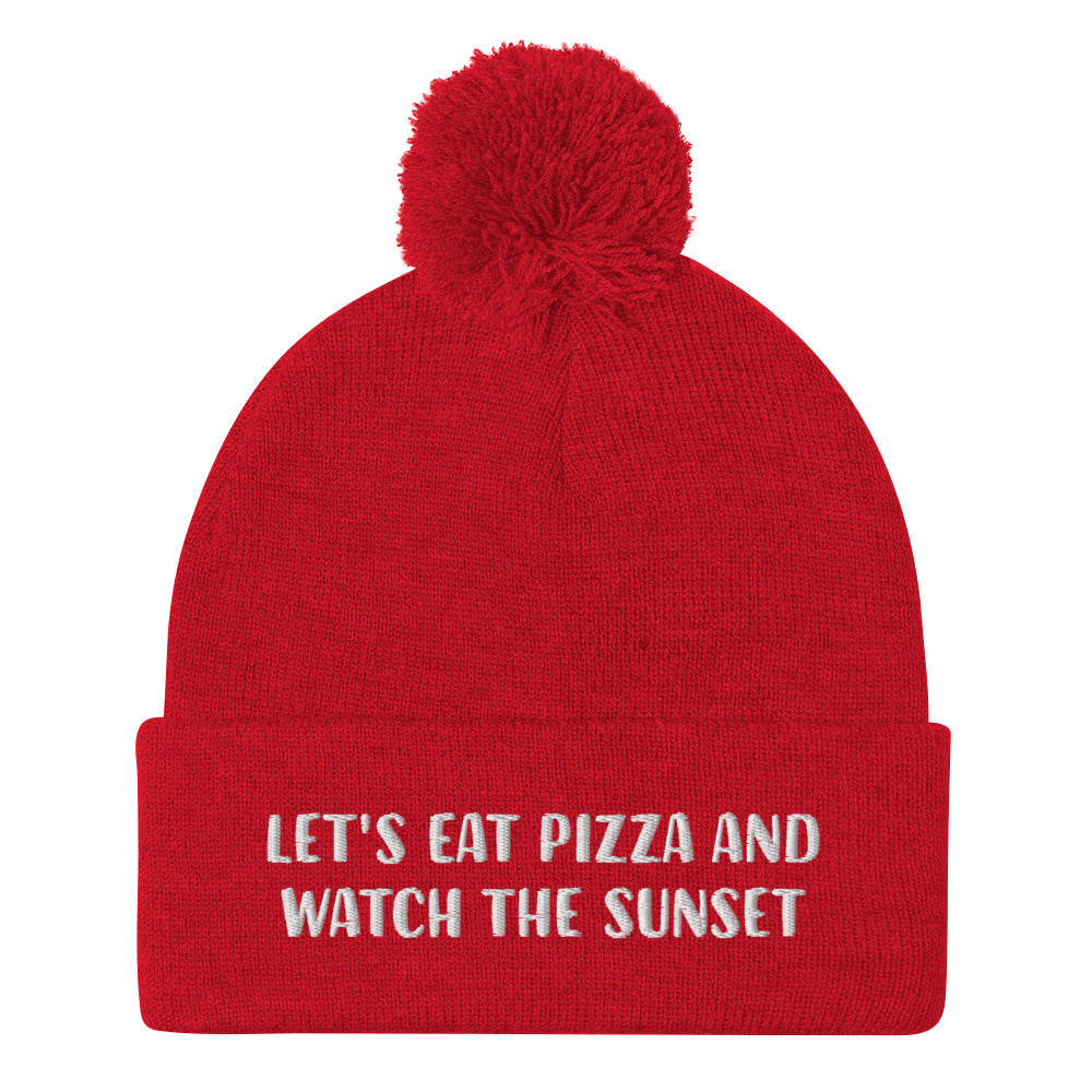 Funny sunset and pizza lover red beanie with white embroidery for foodies - Let's eat pizza and watch the sunset in a unique beanie with a funny message. This cute beanie is a warm hat for cozy nights in and outdoor adventures. It's a classic unisex embroidered beanie with a pom pom on top. Love sunsets and pizza? Wear this funny foodie beanie or give it as a unique gift for pizza lovers.  