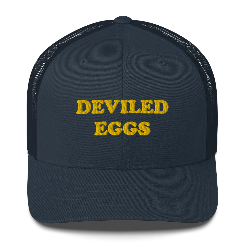 Finally you can eat your favorite deviled eggs in a classic deviled eggs trucker hat. This "DEVILED EGGS" hat is a funny and weird trucker hat for foodies everyday. It's a perfect weird gift for foodies. Wear your favorite foods in our funky foodie clothing. Shop funny foodies hats, weird beanies, unique foodie clothing, and more.