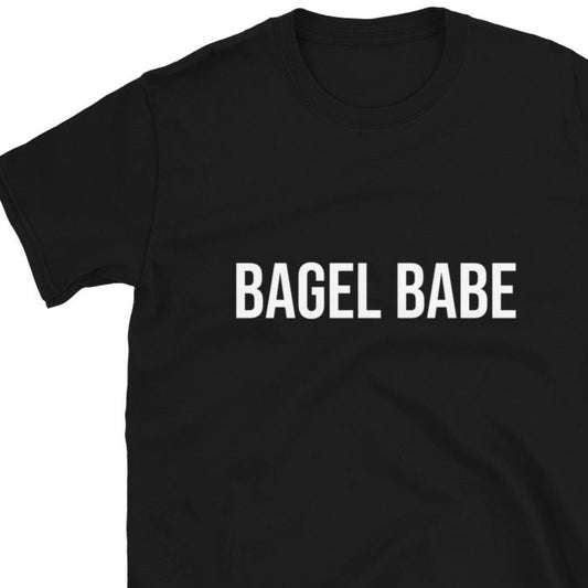 Black bagel babe t-shirt - Calling all bagel babes! Eat your favorite bagel in style in this unisex funny bagel lover t-shirt. It's soft, comfortable and made just for you. If you love bagels, this bagel babe t-shirt is perfect for every day funky foodie street wear. Or give it as a funny gift for bagel enthusiasts and foodies of all kinds. 